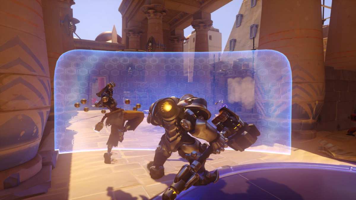 Reinhardt protecting Zenyatta with shield in Overwatch