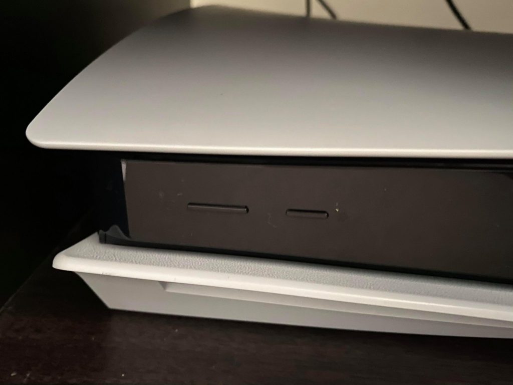 a photo of the playstation 5 on button