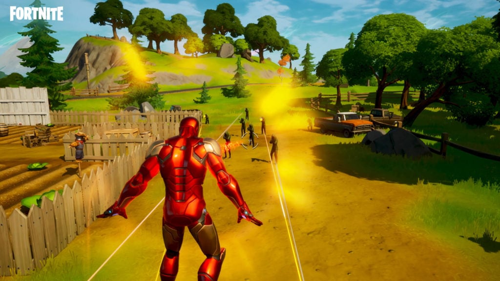 Ironman is aiming his beams at many enemies as he floats above them and takes fire.