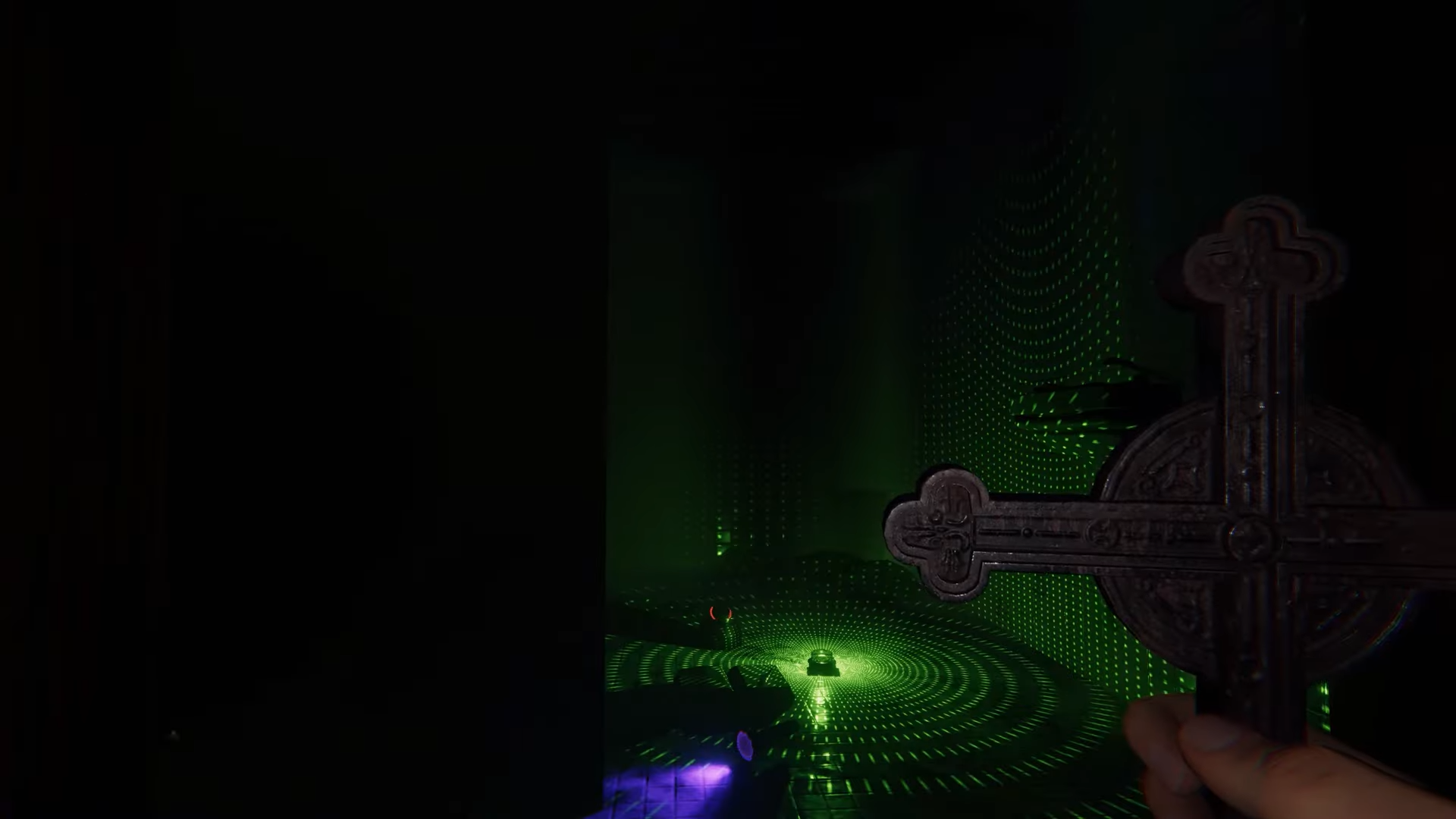 The player holding a Crucifix while looking at a DOTS projector on the ground.
