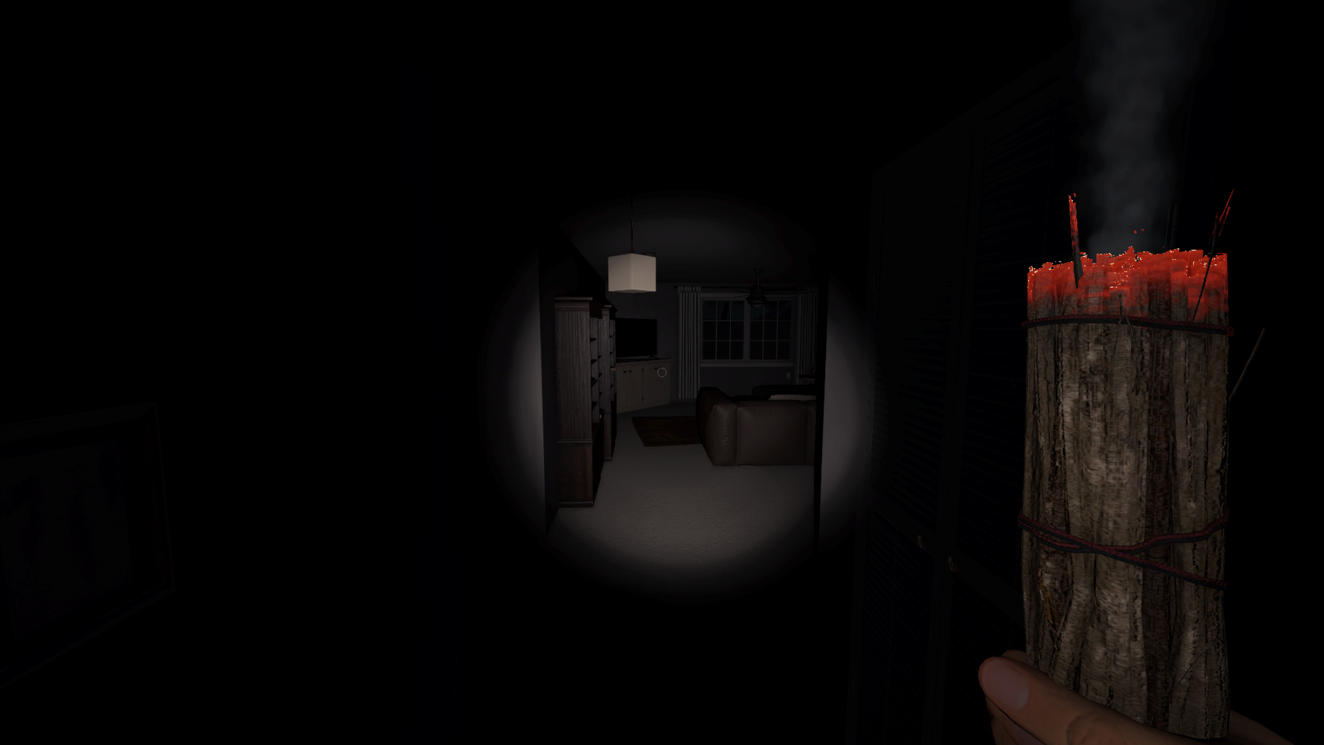 A player holds a smudge stick, which is lit and burning with white smoke. The area is dimly lit by the stick, revealing a living room with a couch and cabinets directly in front of the player in Phasmophobia.