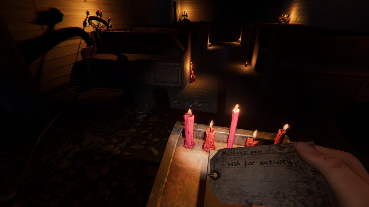 The Player holding a Monkey Paw tag that reads "I wish for activity" while in the chapel of Sunny Meadows Mental Institution in Phasmophobia.
