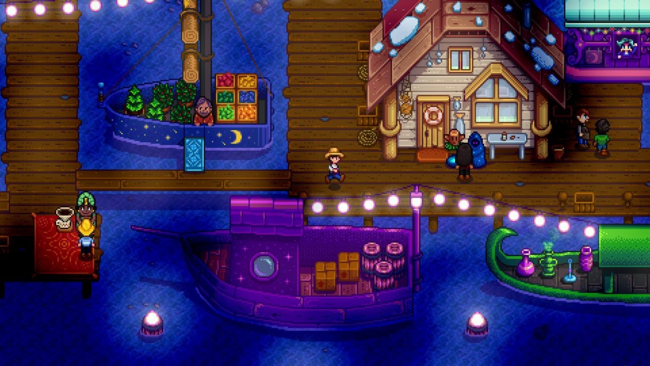 A pixelated town at night with string lights, people, houses, and boats in Stardew Valley
