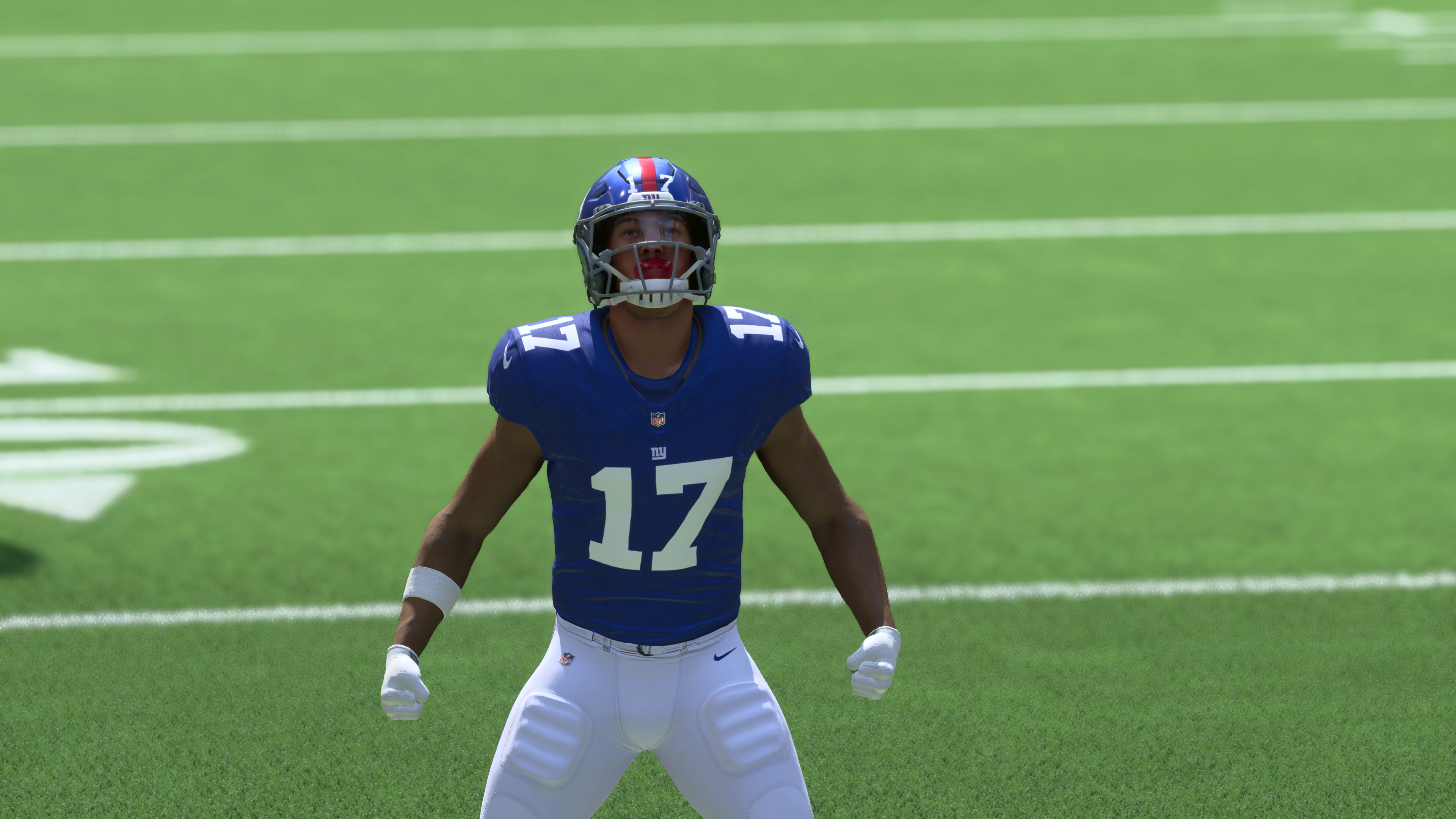 A player in Madden 24 Ultimate Team celebrates on the field.