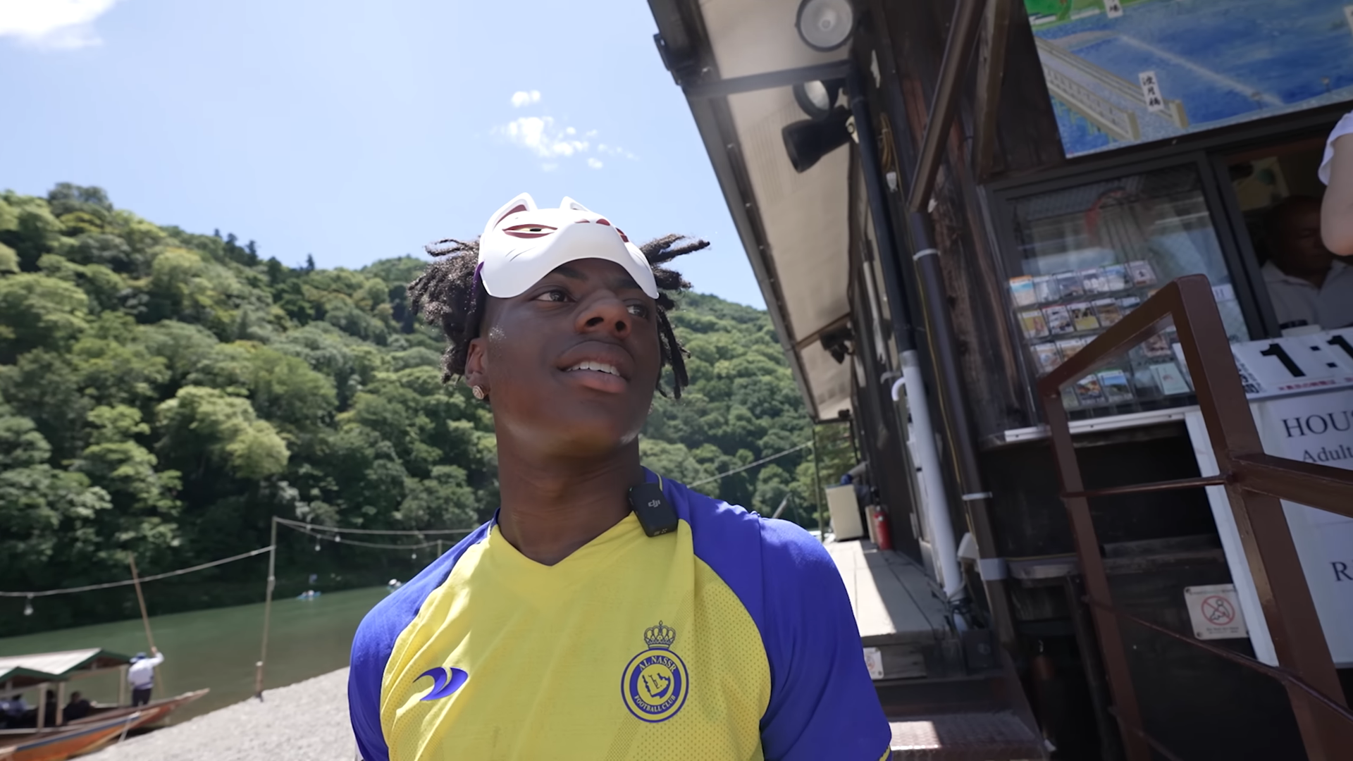 IShowSpeed wearing a fox mask on his head while in Japan