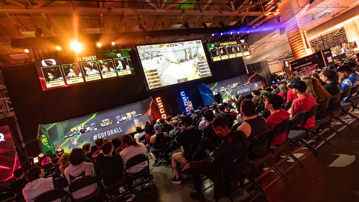 A crowd sits and watches the ESL Impact female tournament at IEM Dallas.