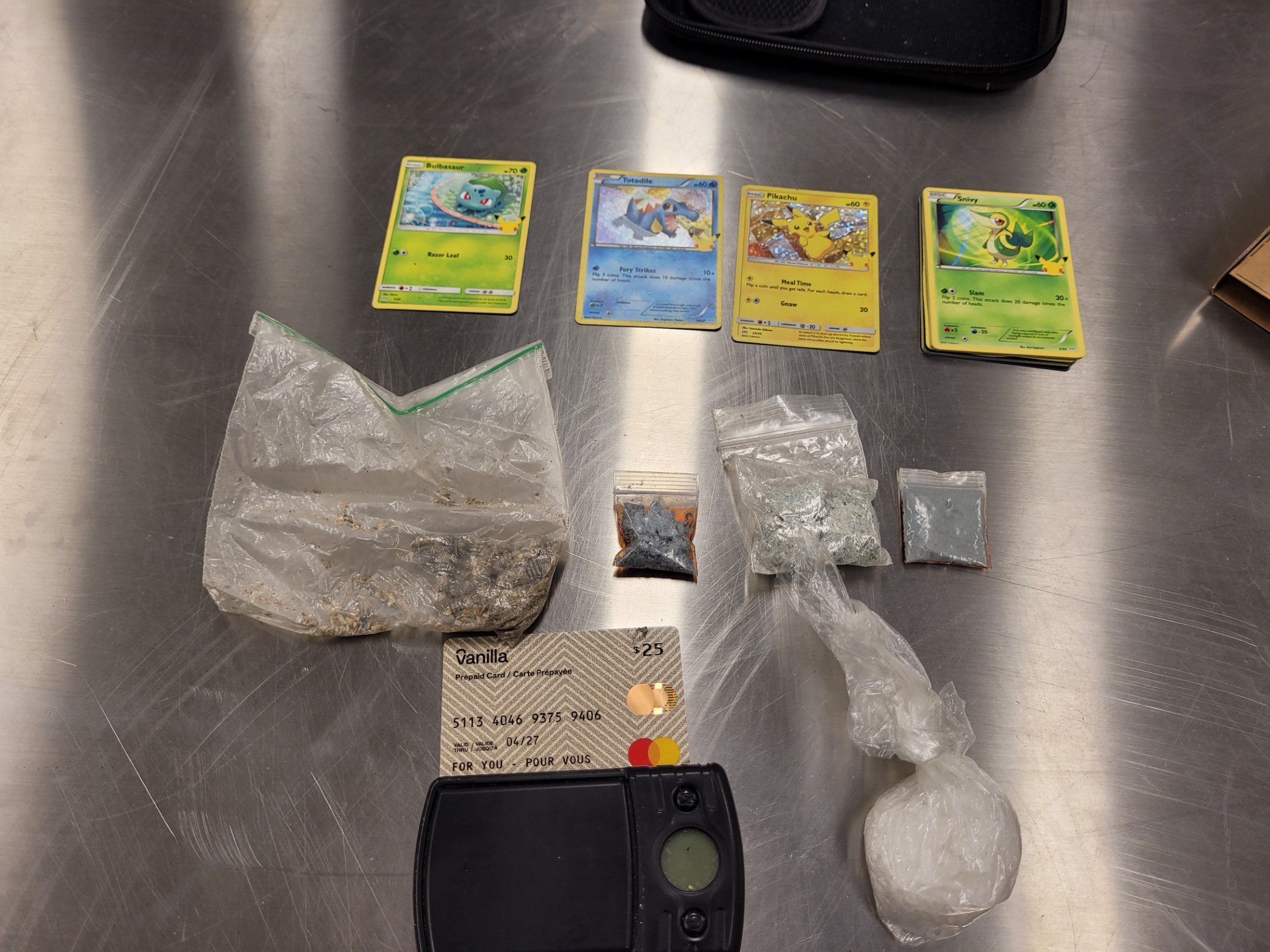 Image of Pokémon TCG cards and drugs from arrest Image through Cochrane RCMP