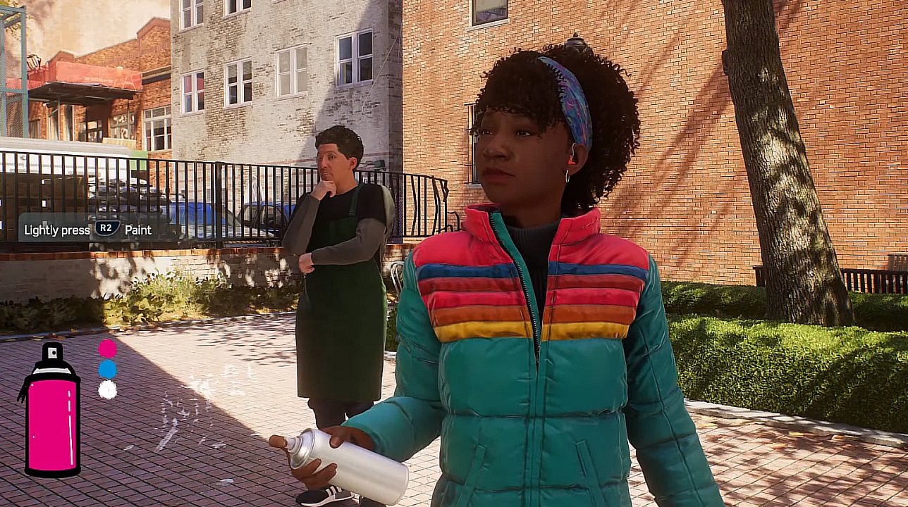 There is an image of Hailey holding a spray paint bottle. There is someone behind her wearing an apron.