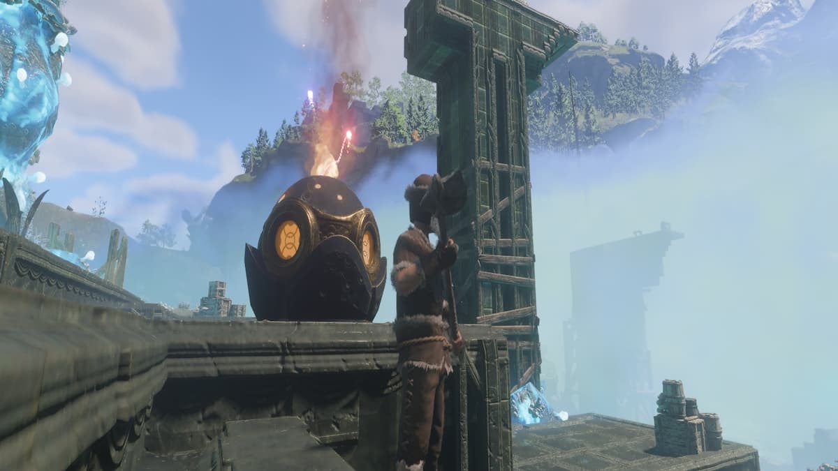 Man standing by ab alter, an egg-shaped rock statue with flame coming out of it.