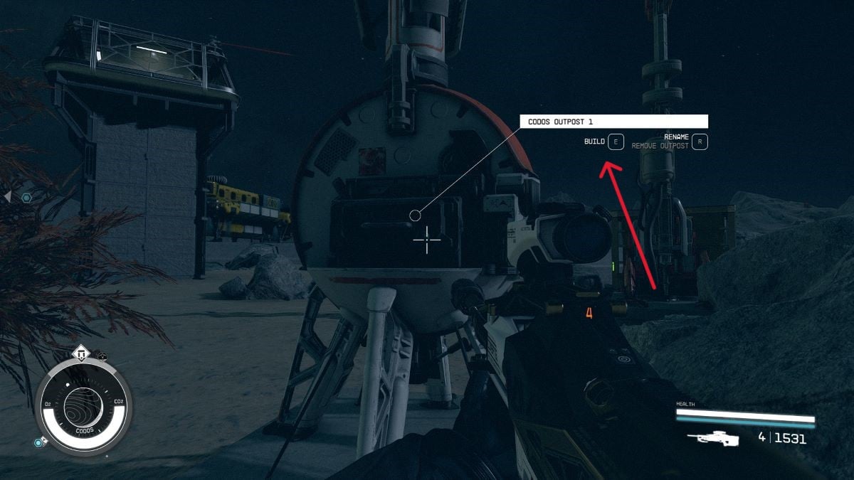 An in game screen of an outpost in Starfield. A red arrow points out the Build option on the outpost.