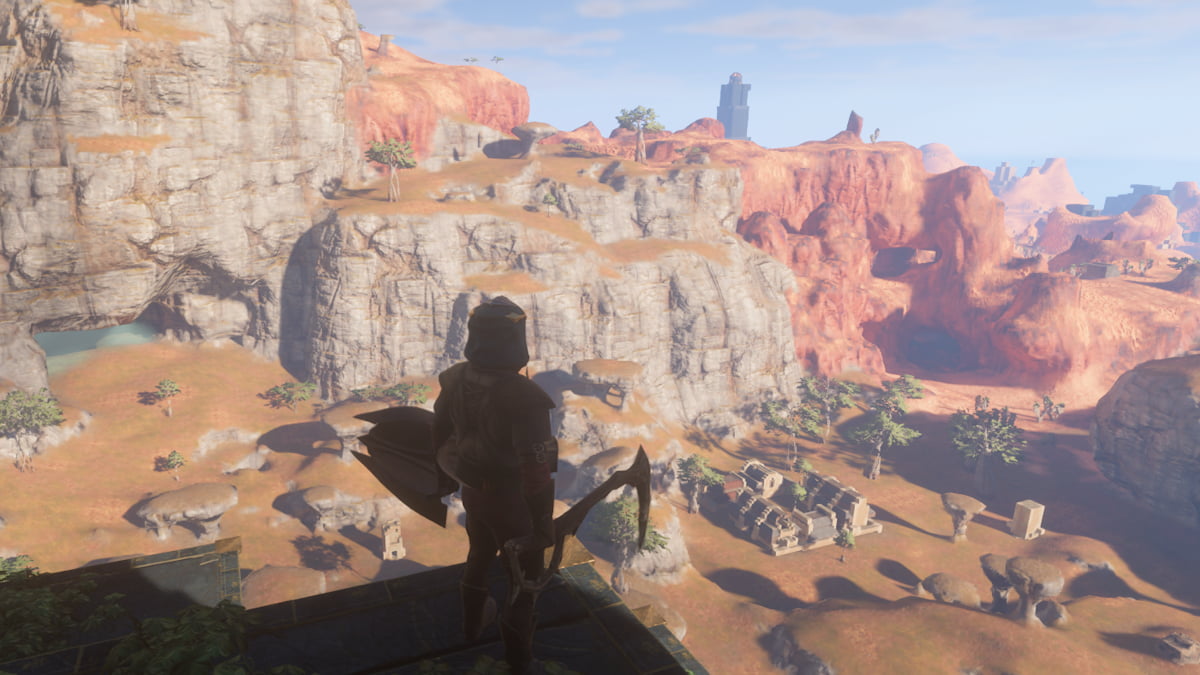 A character from Enshrouded stands on a cliff, overlooking a desert terrain.