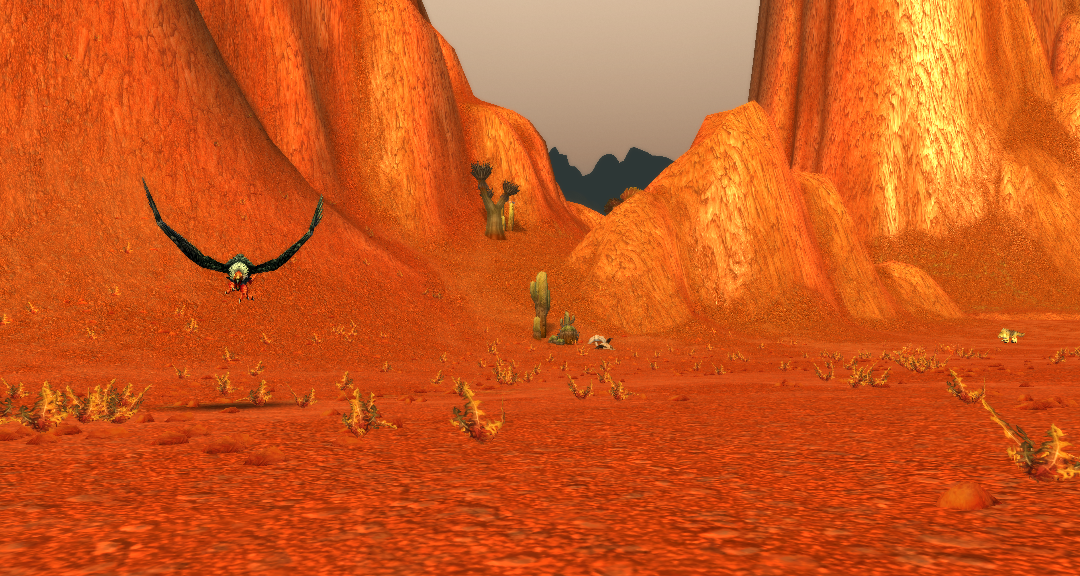A buzzard charges a player in the Badlands in WoW Classic