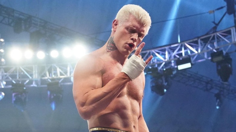 Cody Rhodes celebrates on stage while wrestling
