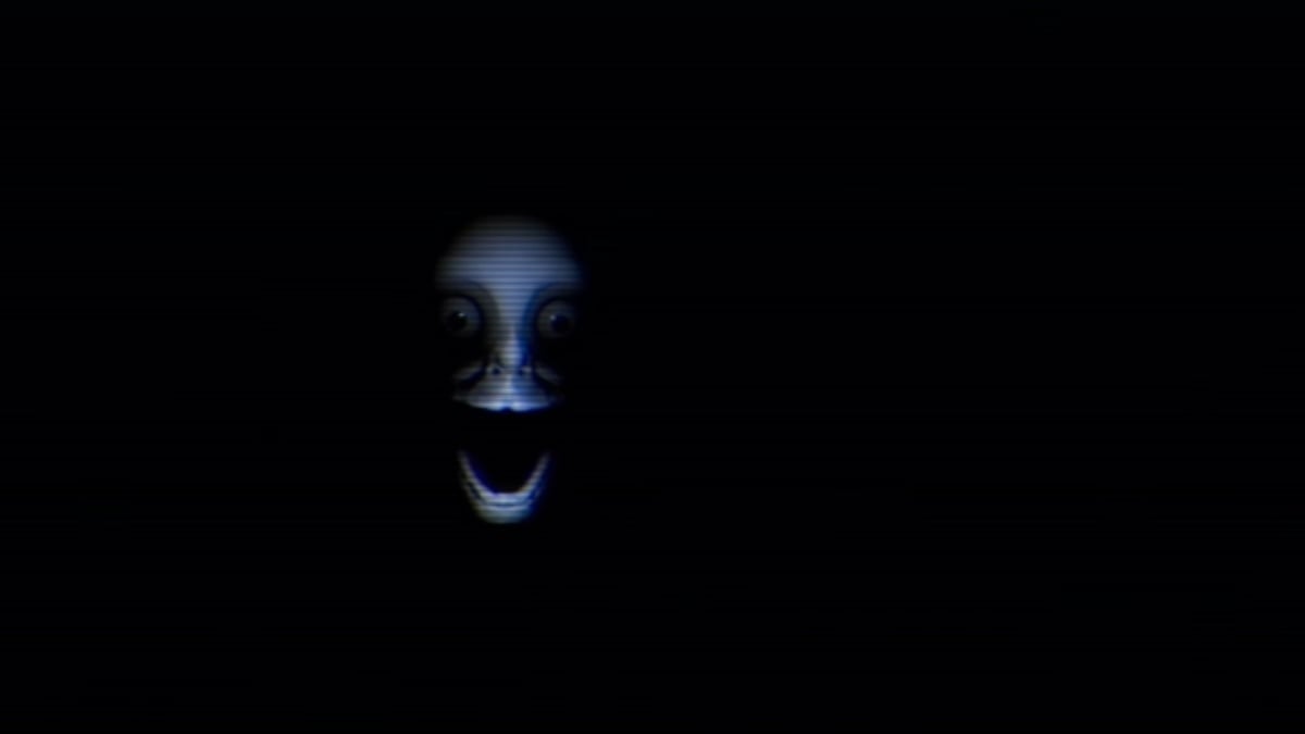 Smiley's face appearing in the darkness