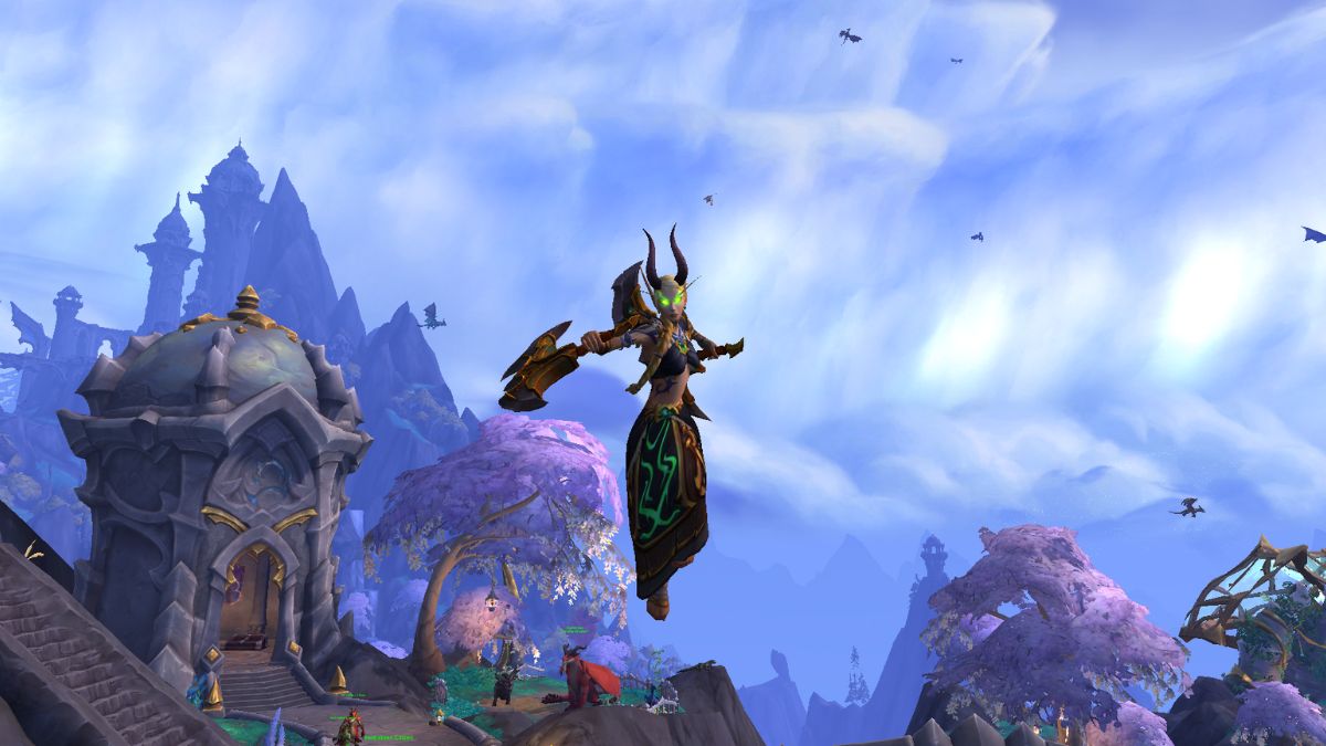 Demon Hunter leaping with weapons in World of Warcraft.