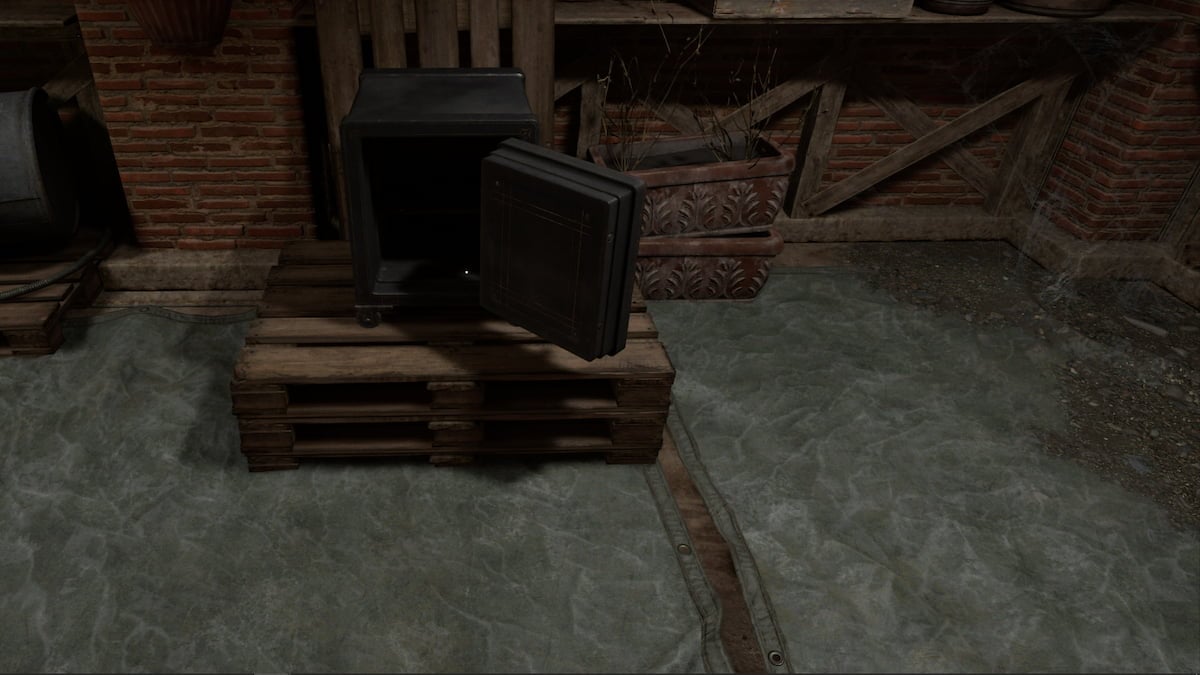 An open safe sitting on a stack of wooden pallets.