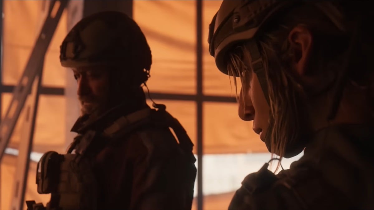 A side shot of wo mercenaries looking off to the left in Crossfire