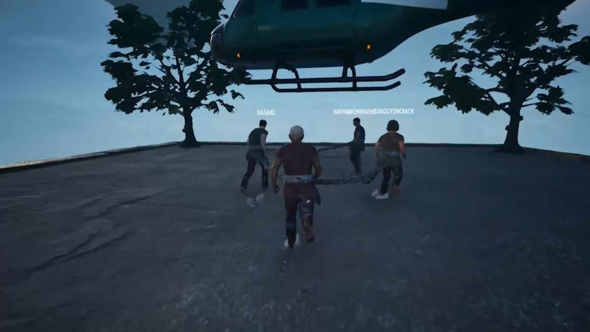 characters chained together in chained together co-op with 4 players approaching a helicopter