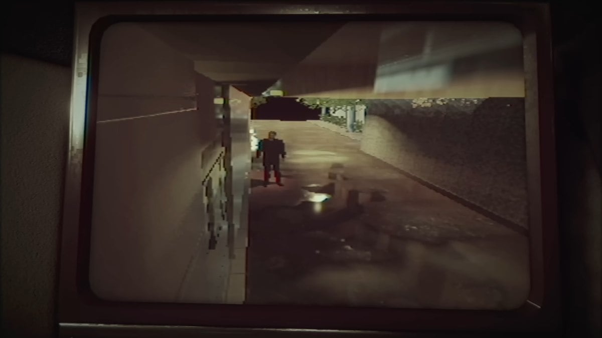 An ominous shot on the camera monitor of a man standing outside the coffee shop in The Closing Shift