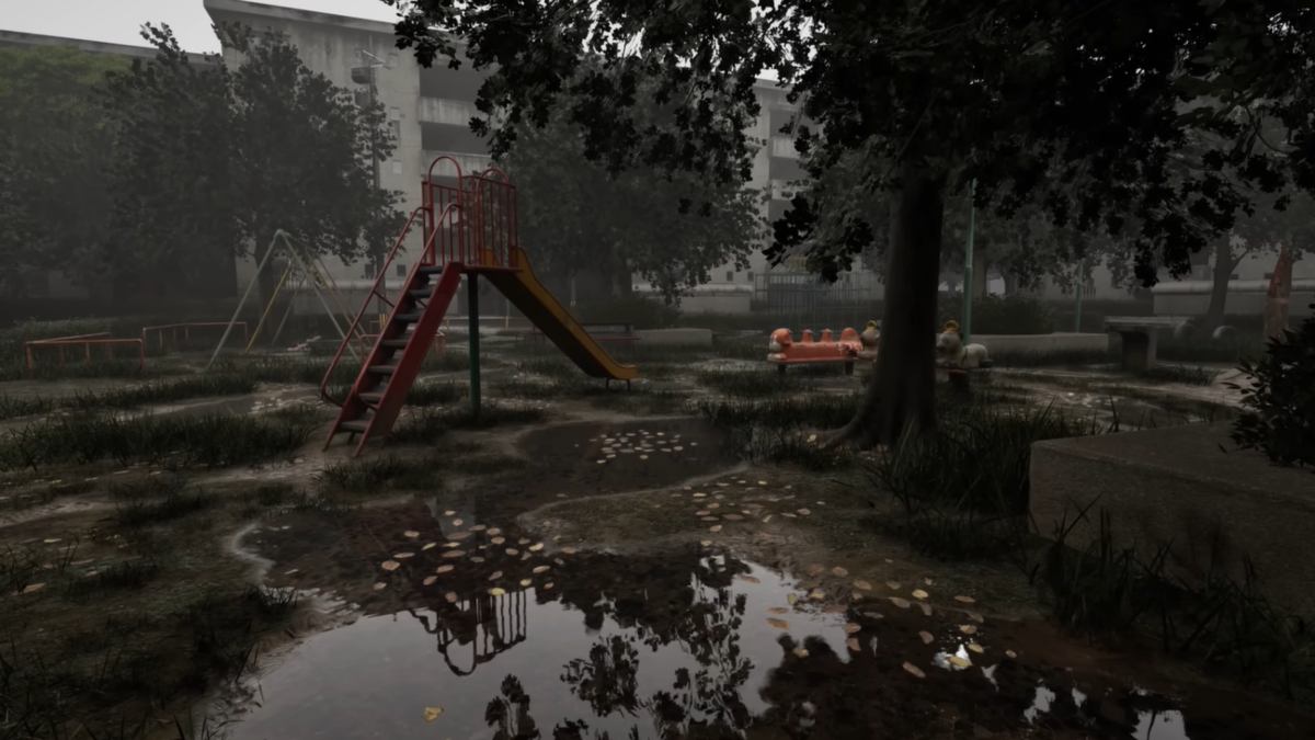 A wide shot of the neighborhood park in Cursed Digicam with the slide and tree in view, and apartment building in the back