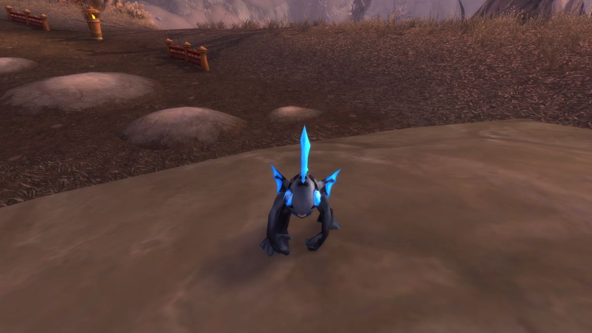 Murloc battle pet on the ground in World of Warcraft.