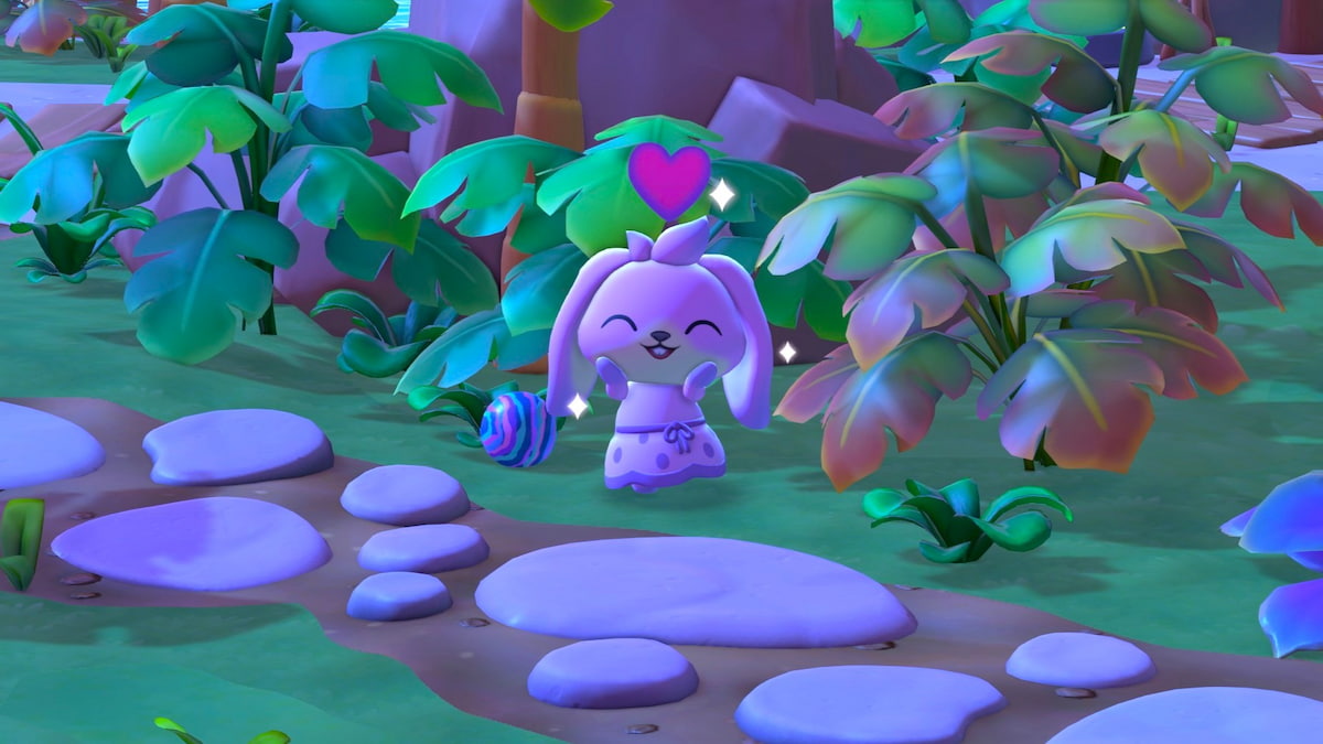 A pink bunny standing by a rubber ball at the base of a palm tree while smiling with her eyes closed in Hello Kitty Island Adventure.
