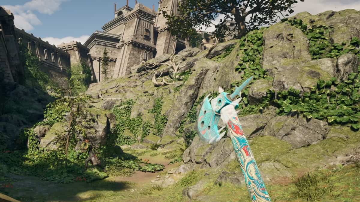 A player in Avowed wielding an axe looking at large rocks near a town.