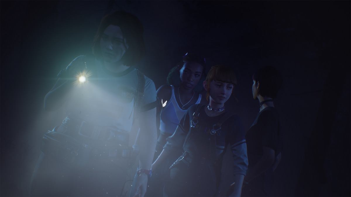 four friends exploring in the dark with a flashlight