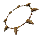 A necklace made of animal teeth. This is the Effigy Necklace Totem Fragment from Avowed.