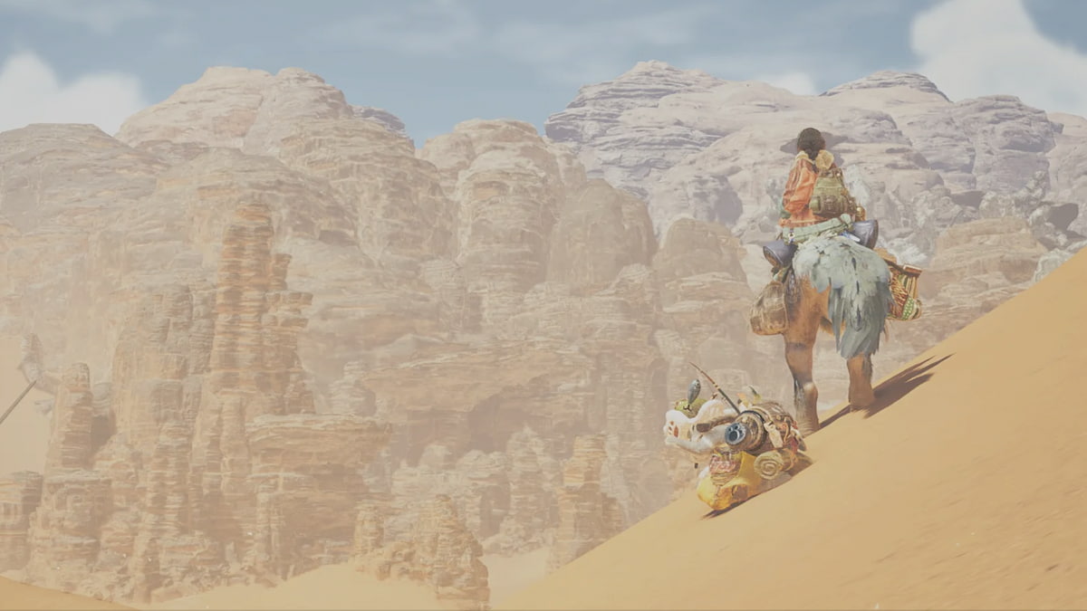 A woman standing on a sandy hill in Monster Hunter Wilds