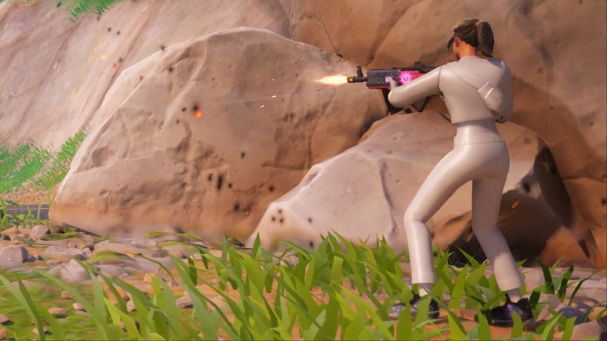 character shooting a gun and dressed all in white with dark hair
