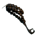 A key-shaped object with a handle made of black prayer beads. this is the Obsidian Prayer Beads totem fragment from Avowed.