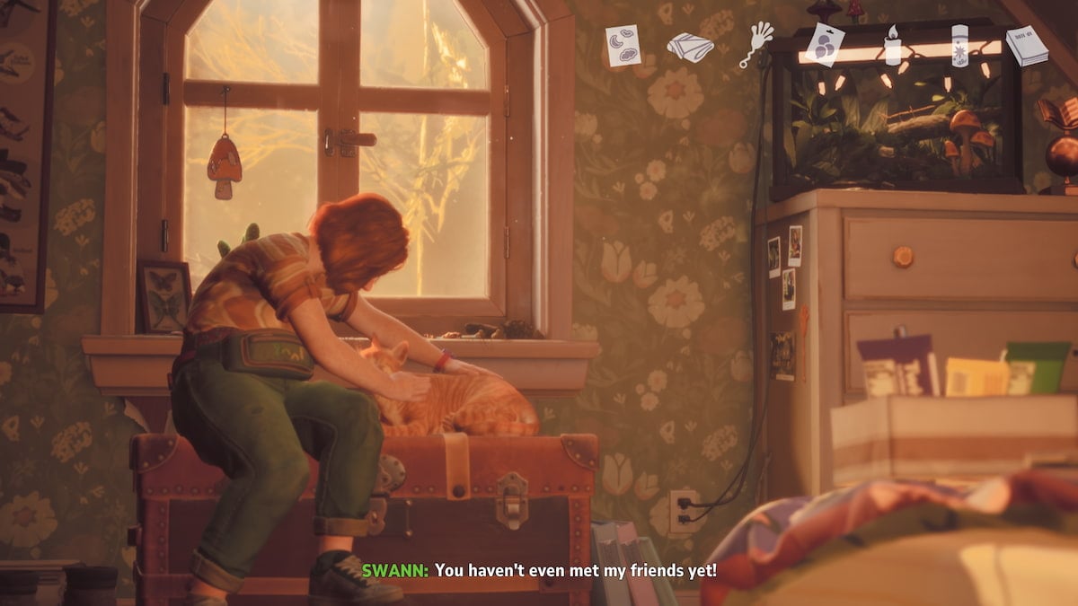 Swann with her ginger cat in her bedroom