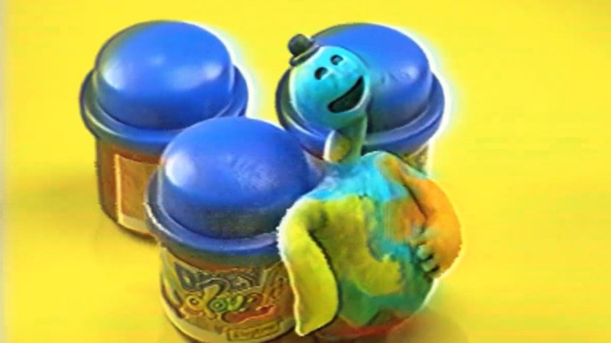 Doey commercial at start of Poppy Playtime Chapter 4 with Doey smiling and looking up, standing beside his play-doh pots