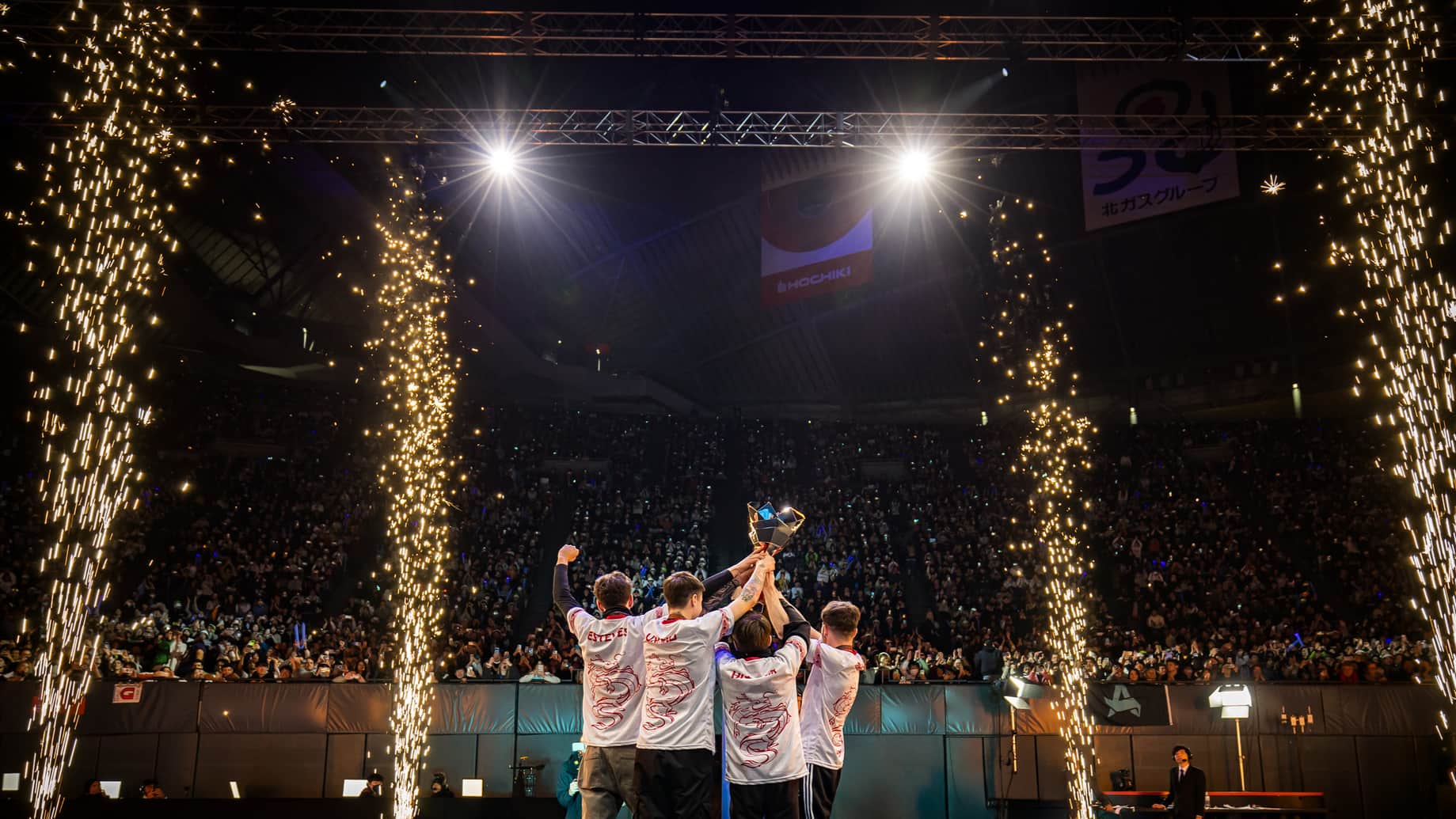 GoNext lift the ALGS Championship trophy in front of a huge crowd as sparklers go off around them.