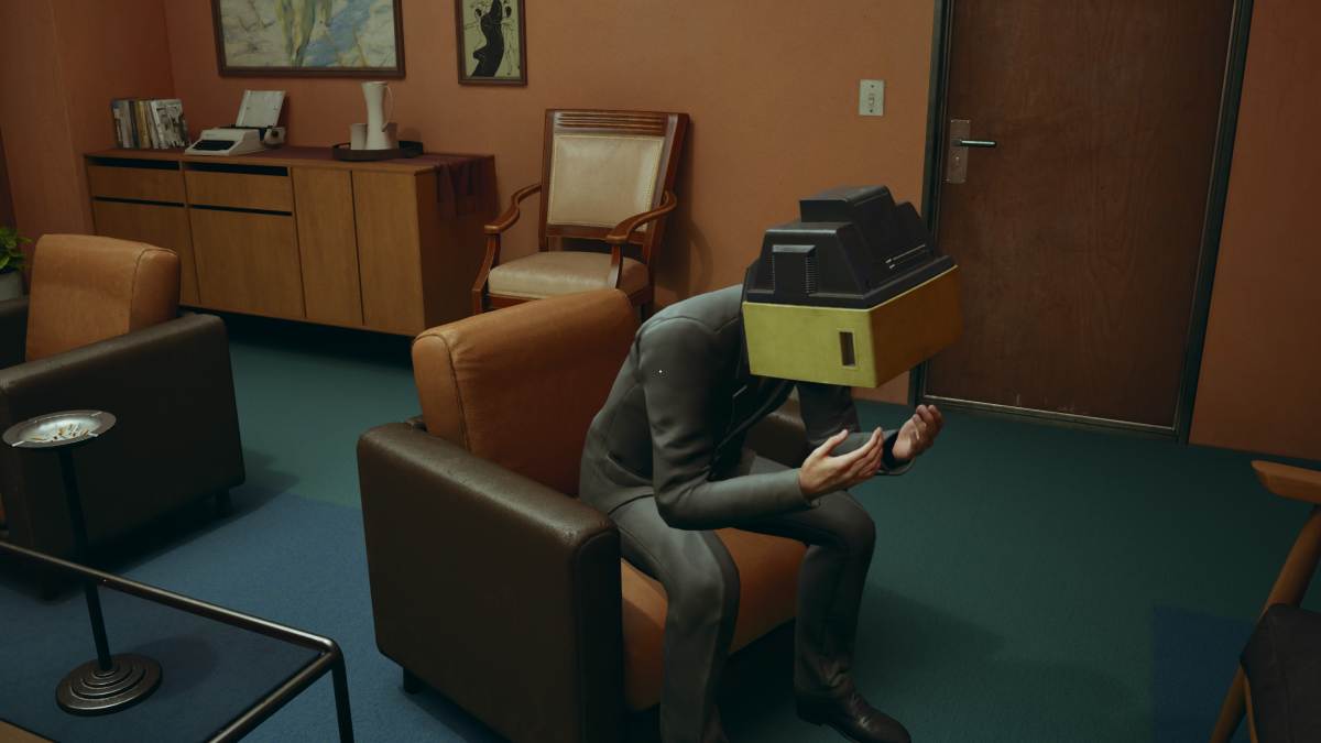 Looking at a suited man with a television head, scared and defeated, putting his head in his hands
