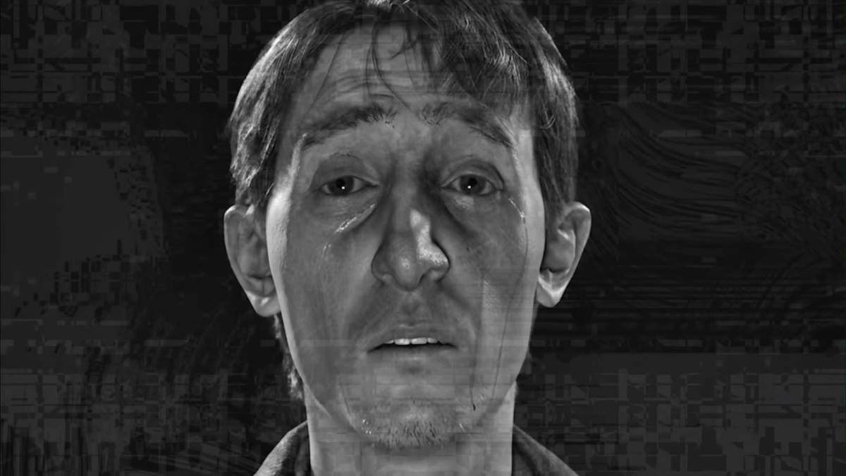 A close up black and white shot of Sean's face in KARMA: The Dark World