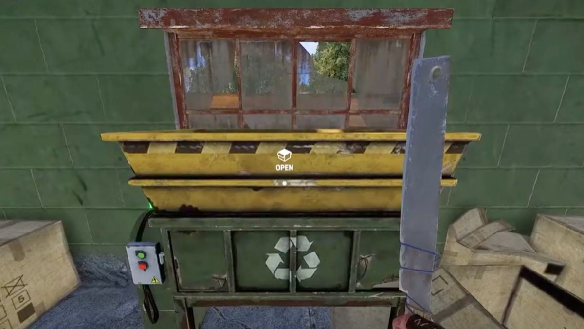 a knife next to a reclying bin