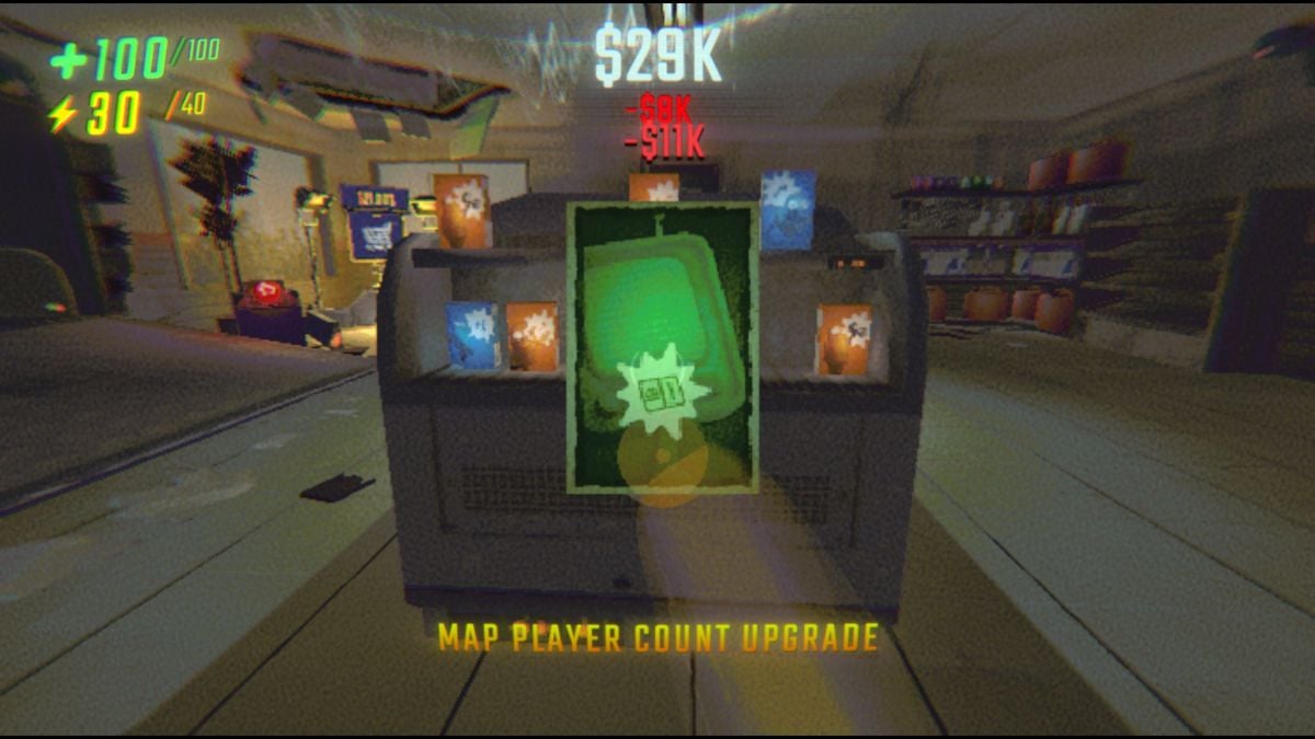 Holding up the Map Player Count Upgrade inside the Service Station with the aisle of Upgrades behind it