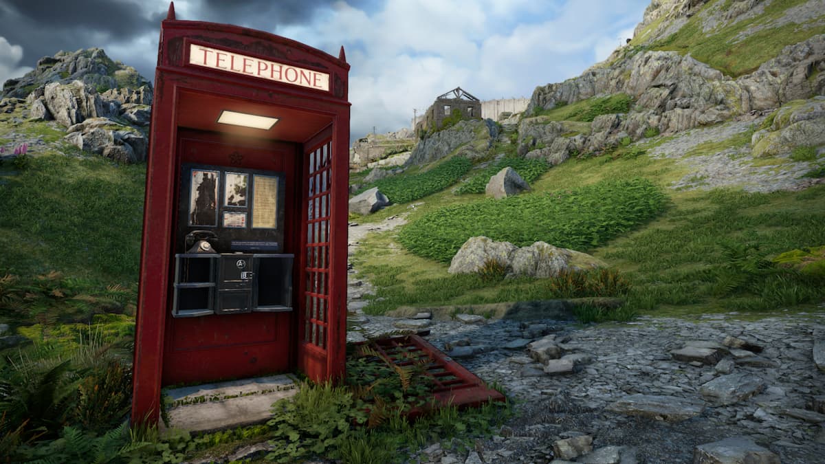 The iconic British red telephone booth standing among rocks on a mountain side in Atomfall.