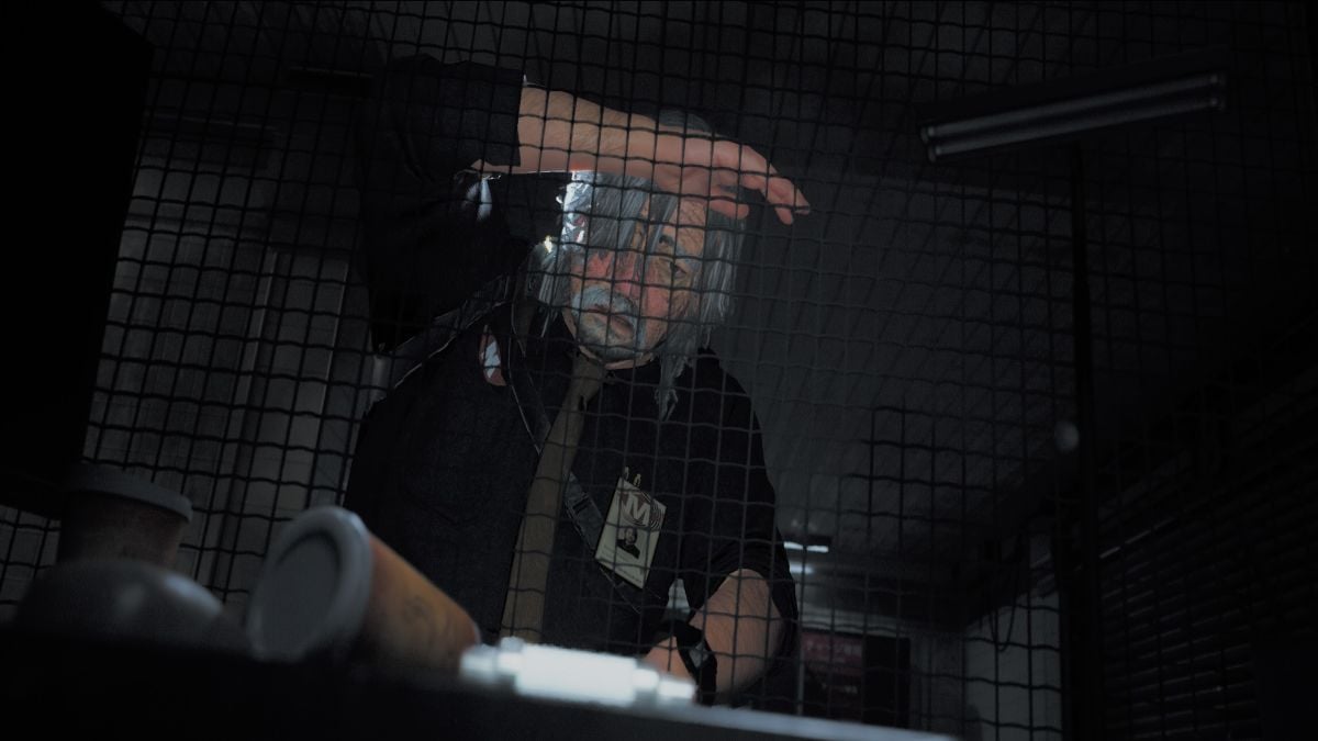 Roman looking through the grate at the fuse on the desk