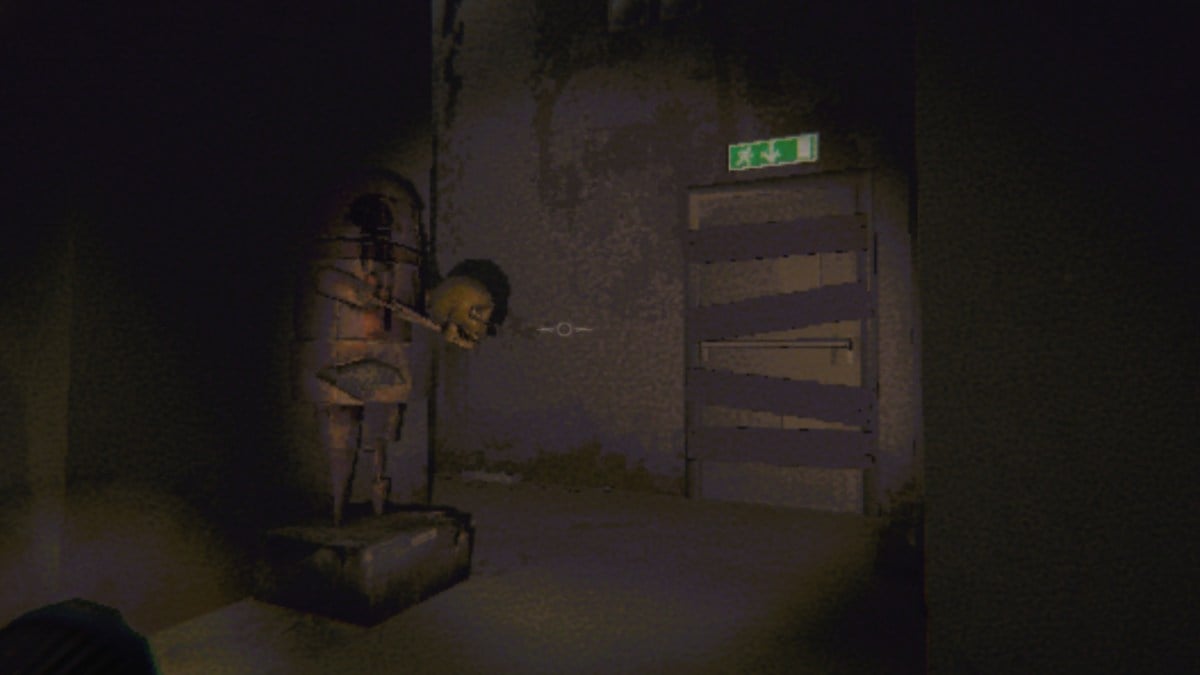 Looking at a semibot statue holding a skull, next to a boarded-up fire exit door