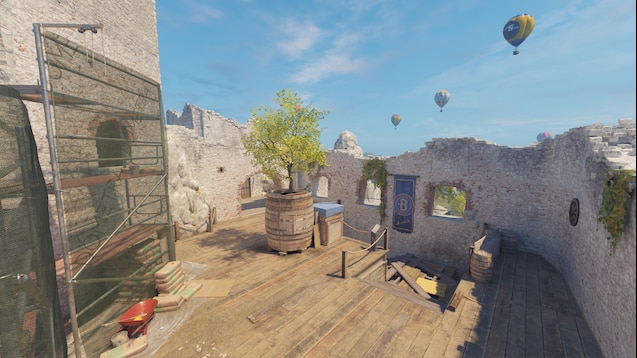 Overview of the Jura map in CS2, showing the B site with a wooden platform and the sky with hot air balloons.