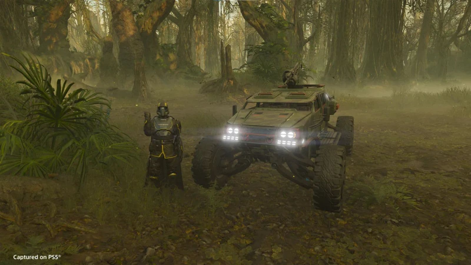 A Helldiver beside an FRV within a forest in Helldivers 2.