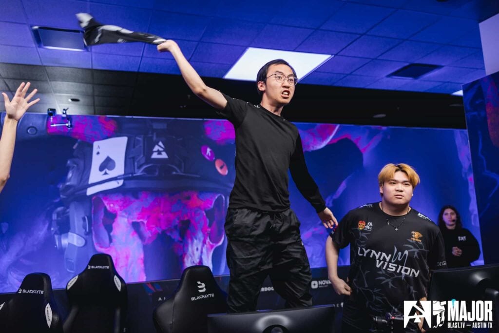 EmiliaQAQ stands and waves his jersey after Lynn Vision Gaming secures a victory at BLAST Austin Major 2025.