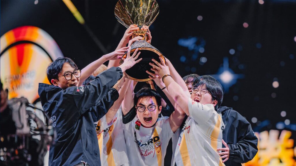 EDward Gaming lift the trophy after winning the VALORANT Champions 2024 tournament.