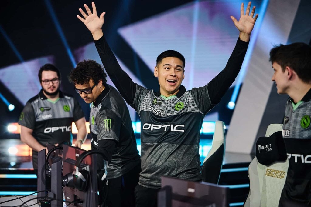 Shotzzy smiles and raises his hand after OpTic Gaming secure a victory at BO6 EWC 2025.