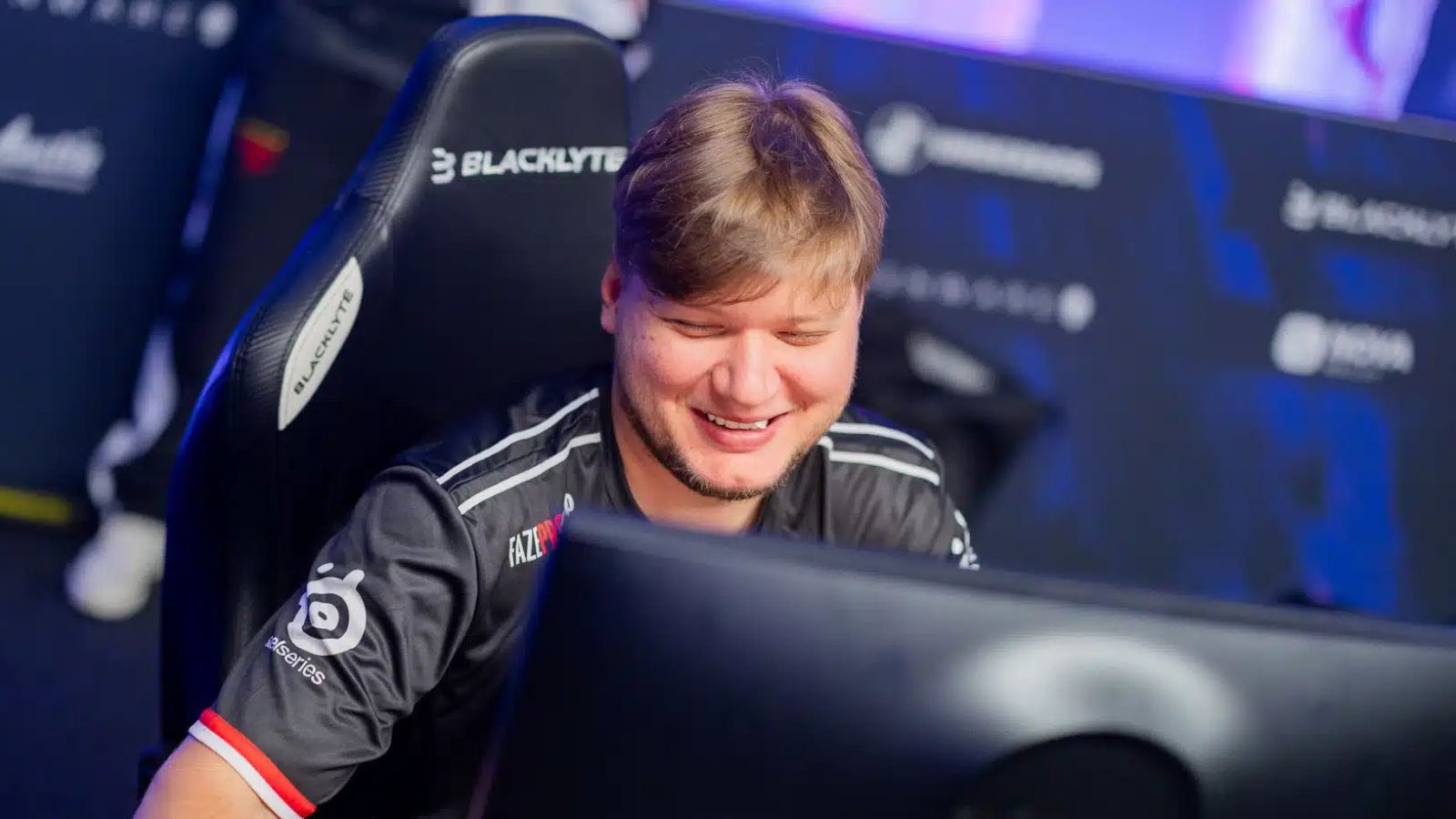 FaZe Clan's s1mple smiling during a match at the Austin Major 2025.