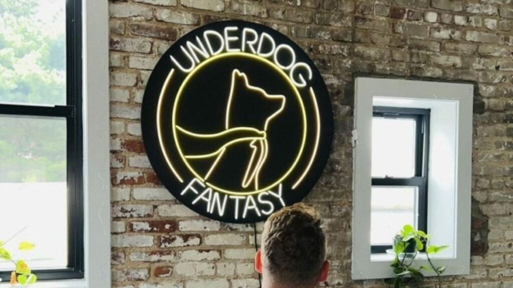 Underdog Sports fantasy logo posted on a wall.