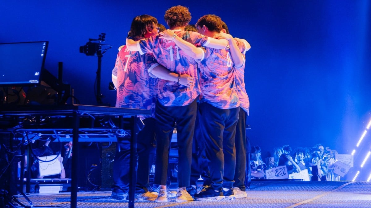 a team huddle between Paper Rex players